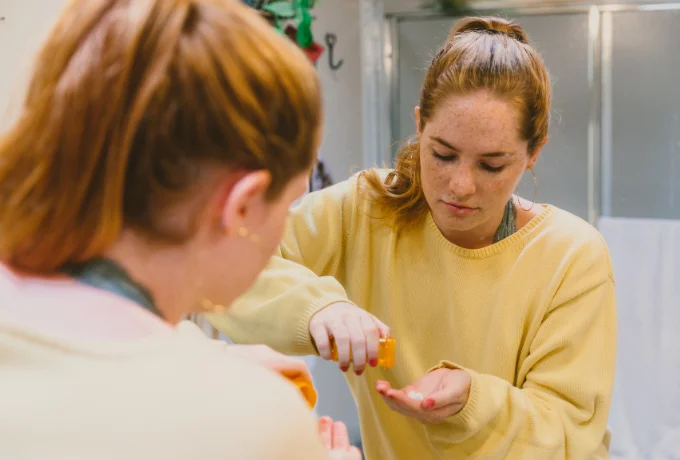 Young Adult Woman Taking Medicine