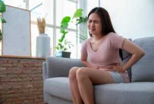 Young Woman Feeling Abdominal Pain